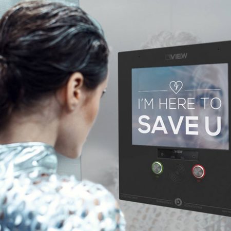 Young cyber woman in silver futuristic costume looking in the mirror