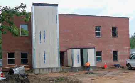 BCI-Construction-To-Build-Glass-Elevator-At-Walkway