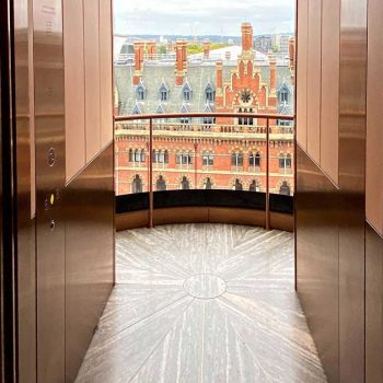 2- View of St Pancras International train station from the car of the external elevator of Hotel Standard in central London, England