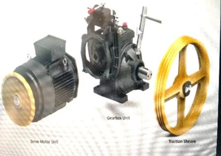 Figure 1: A traditional geared traction machine and a modern gearless elevator motor with belt technology; Zeihl-Abegg is on the right.
