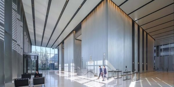Elevator bank in Suhe Centre; image courtesy of Foster + Partners