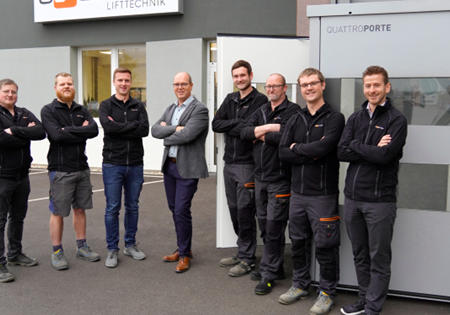 Managing Director Erwin Roither (fourth from left), Head of Sales Julian Grad (right) and the Ascendor team leaders from production; photo courtesy of Ascendor Lifttechnik