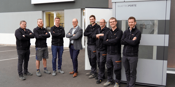 Managing Director Erwin Roither (fourth from left), Head of Sales Julian Grad (right) and the Ascendor team leaders from production; photo courtesy of Ascendor Lifttechnik