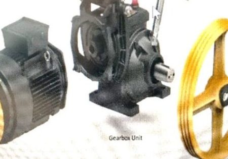 Figure 1: A traditional geared traction machine and a modern gearless elevator motor with belt technology; Zeihl-Abegg is on the right.