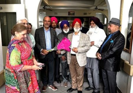 Harry Bains (holding the bouquet) with members of Surrey-Delta Indo Canadian Seniors Society; image via Indo-Canadian Voice