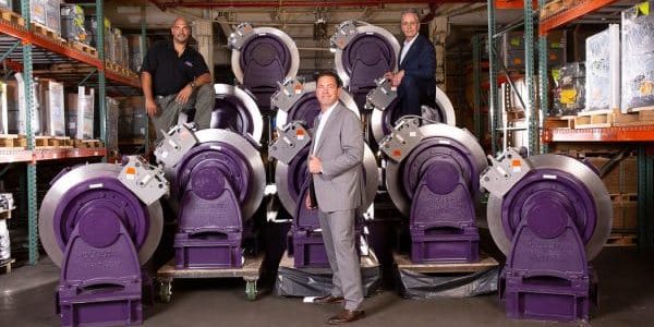 (l-r) Frank Feniello, Don Gelestino and Rob Masterson with Hollister-Whitney machines; photo courtesy of Champion Elevator