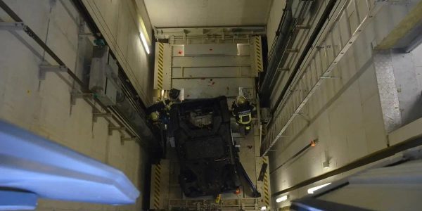 Car and Driver Fall Down German Elevator Shaft