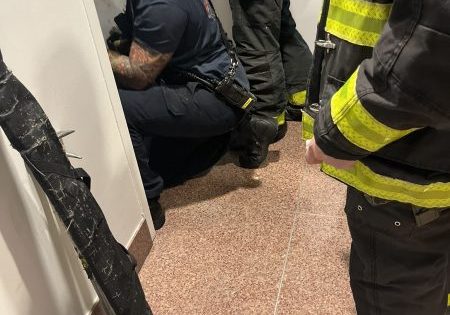 FDNY firefighters work to release the basketball players; image courtesy of FDNY. 