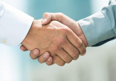 Close-up image of a firm handshake standing for a trusted partnership