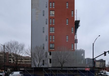 A construction hoist is seen outside The Foglia Residences at Chicago Lighthouse; photo by Jack Crawford for Chicago YIMBY.