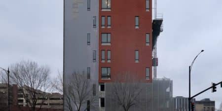 A construction hoist is seen outside The Foglia Residences at Chicago Lighthouse; photo by Jack Crawford for Chicago YIMBY.