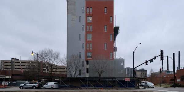 A construction hoist is seen outside The Foglia Residences at Chicago Lighthouse; photo by Jack Crawford for Chicago YIMBY.