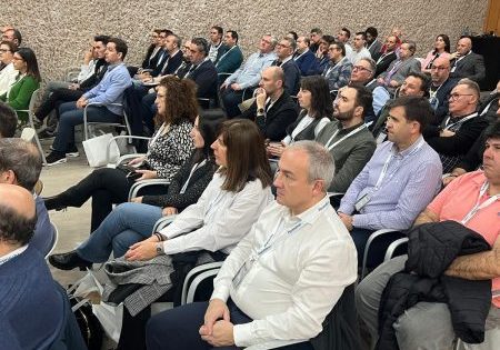 Attendees listen to a presentation; image courtesy of Fermator.