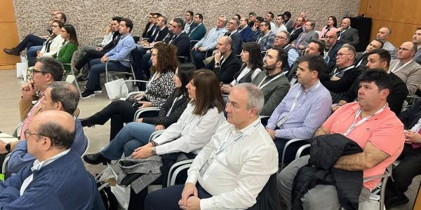 Attendees listen to a presentation; image courtesy of Fermator.
