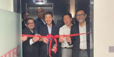 Fujitec India employees cut the ribbon for the new office; image courtesy of Fujitec India via LinkedIn. 