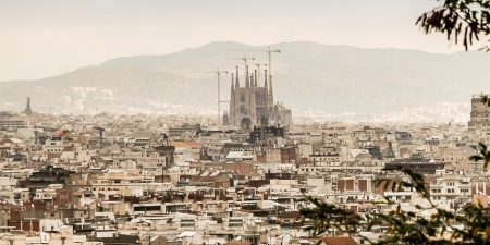 Barcelona skyline, including the famous Sagrada Família basilica designed by Antoni Gaudí; photo by jarmoluk for Pixabay