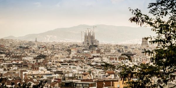 Barcelona skyline, including the famous Sagrada Família basilica designed by Antoni Gaudí; photo by jarmoluk for Pixabay