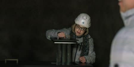 ELEVATOR WORLD Senior Associate Editor Kaija Wilkinson checks out UltraRope in KONE’s underground laboratory and test tower in Tytyri, Finland, in 2017; image courtesy of KONE. 