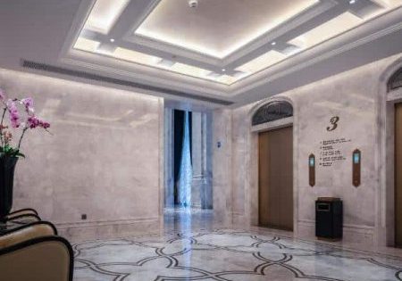 The elevators are designed to match the historic hotel's interior; image via Construction Week.