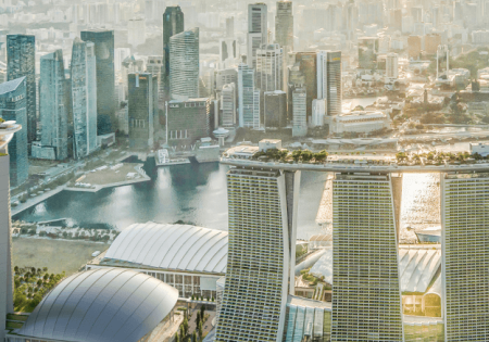 The new hotel tower at MBS, left; image courtesy of Safdie Architects