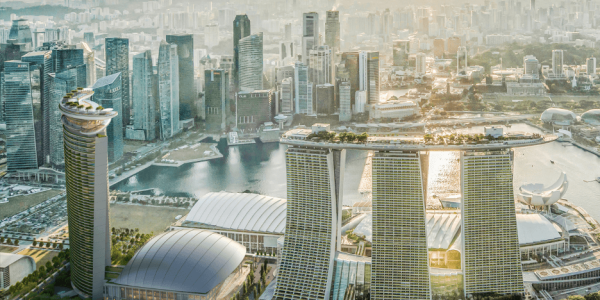 The new hotel tower at MBS, left; image courtesy of Safdie Architects