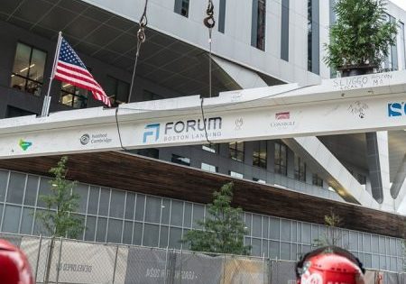 Representatives from Lendlease, Ivanhoé Cambridge and Consigli Construction Co. celebrate the topping-out of Forum, a $545 life sciences project in Boston on Sept. 14; photo courtesy of Lendlease via Construction Dive. 