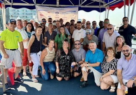 Cruise survivors pose for a group shot.