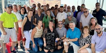 Cruise survivors pose for a group shot.