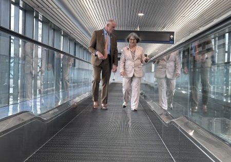 MIA Director and CEO Ralph Cutié and Miami-Dade County Mayor Daniella Levine Cava on MIA's newest moving walk in Concourse D; image courtesy of MIA