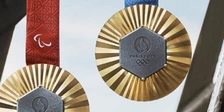 This year's Olympic medals include a hexagonal piece of iron taken from the Eiffel Tower during an elevator modernization. 