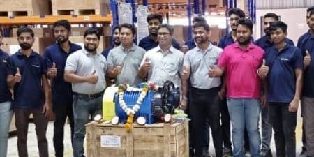 The Nidec India team celebrates their first "Made in India" elevator machine; image courtesy of Nidec India.