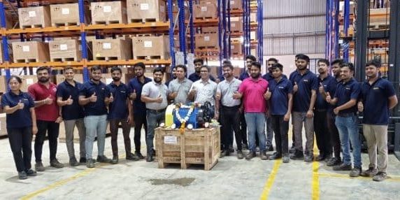 The Nidec India team celebrates their first "Made in India" elevator machine; image courtesy of Nidec India.