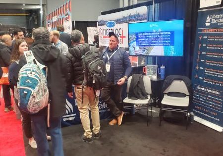 Visitors network at the Liberty Elevator booth; photo by EW Correspondent Matthew Jackson. 