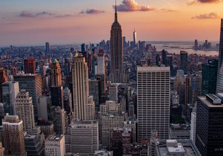 The sun sets over Manhattan; photo by Felix Dilly for Pixabay