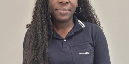 Sara Marta, a refugee from Luanda, Angola, was hired in 2023 as an electromechanical assembler; image courtesy of Otis.  