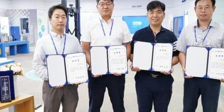 Jay Hwang, Charles Keum, Beomseop Go and Byungduk In of Namsan Seoul Tower Elevator Replacement Project task force Team (from left) received a plaque of appreciation from Namsan Seoul Tower; photo courtesy of Otis Korea.