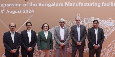 Company leaders, including Otis Chair, CEO and President Judy Marks and Otis India President Sebi Joseph, third and fourth from left, celebrate the expansion news with colleagues; image courtesy of Otis.