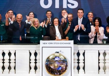 Otis Chair, President and CEO Judy Marks and colleagues cheer after ringing the closing bell on the NYSE; image courtesy of Otis. 