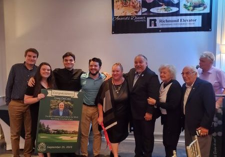 Greg DeCola, fourth from right, accepts the honor with his family by his side; photo by EW Correspondent Matthew Jackson