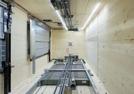 Elevators were installed in wooden shafts using a certified, high-efficiency assembly method; image courtesy of Schindler. 