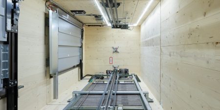 Elevators were installed in wooden shafts using a certified, high-efficiency assembly method; image courtesy of Schindler. 