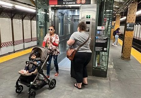 Subway riders take advantage of the brand-new elevator system; photo by Ray Raimundi for MTA.