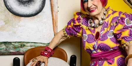 Dame Zandra Rhodes with her Stannah 158 stairlift; image courtesy of Stannah