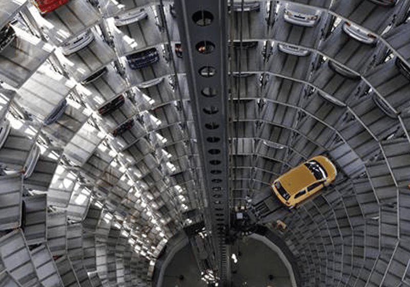 A vehicle is lifted inside a parking tower